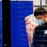Student playing an arcade game